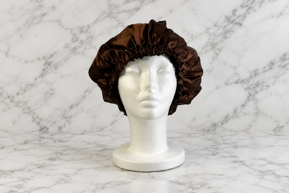 Brown and black bonnet on white marble