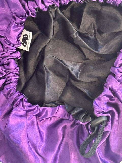 The Stephanie No-Slip Satin Bonnet - interior close-up showing adjustable elastic and ABB label