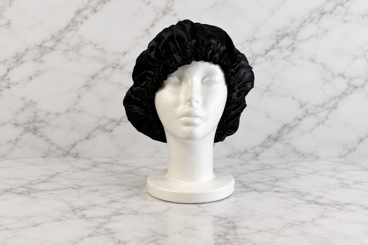 Black bonnet on white marble