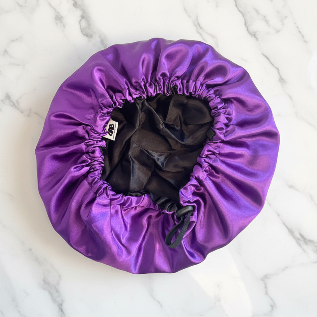 The Stephanie No-Slip Satin Bonnet - interior close-up on marble